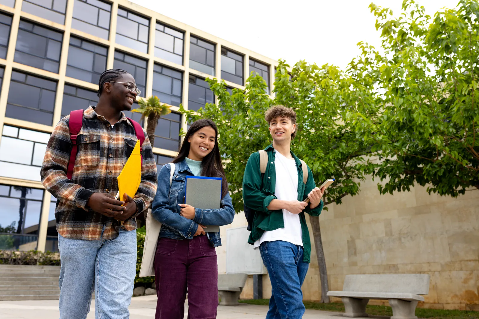 Diverse students walking together on a college campus